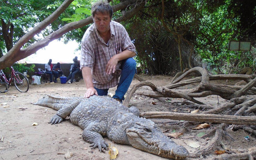 Chris Simpson with a crocodile