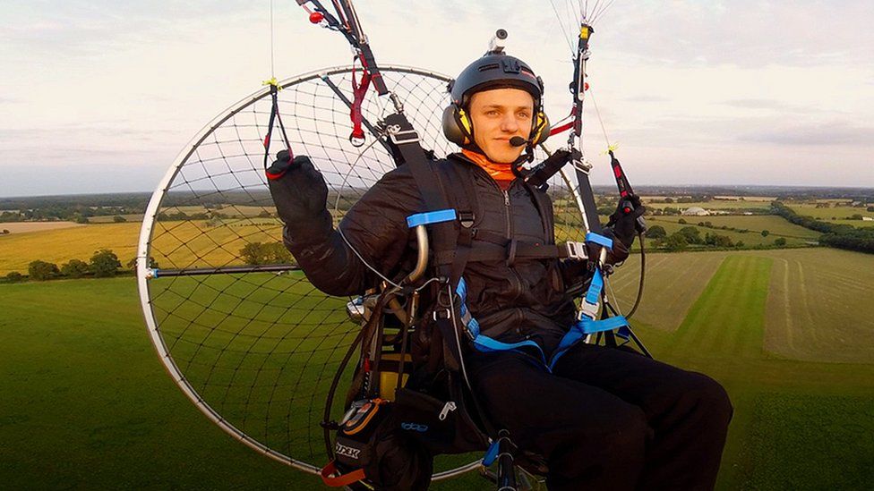 Dan Jones on paramotor above Norfolk countryside