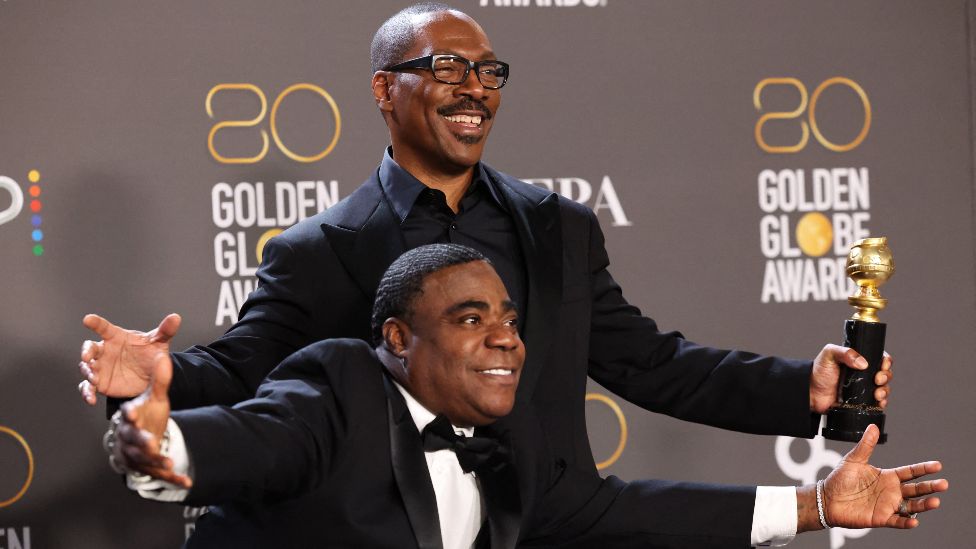 Tracy Morgan presents Eddie Murphy with the prestigious Cecil B. DeMille Award