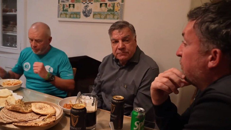 Mike sits at a table with Sam Allardyce and Robbie Fowler