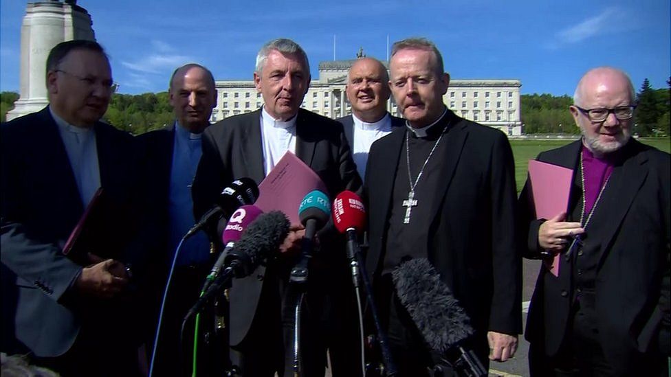 church leaders stand outside Stormont House