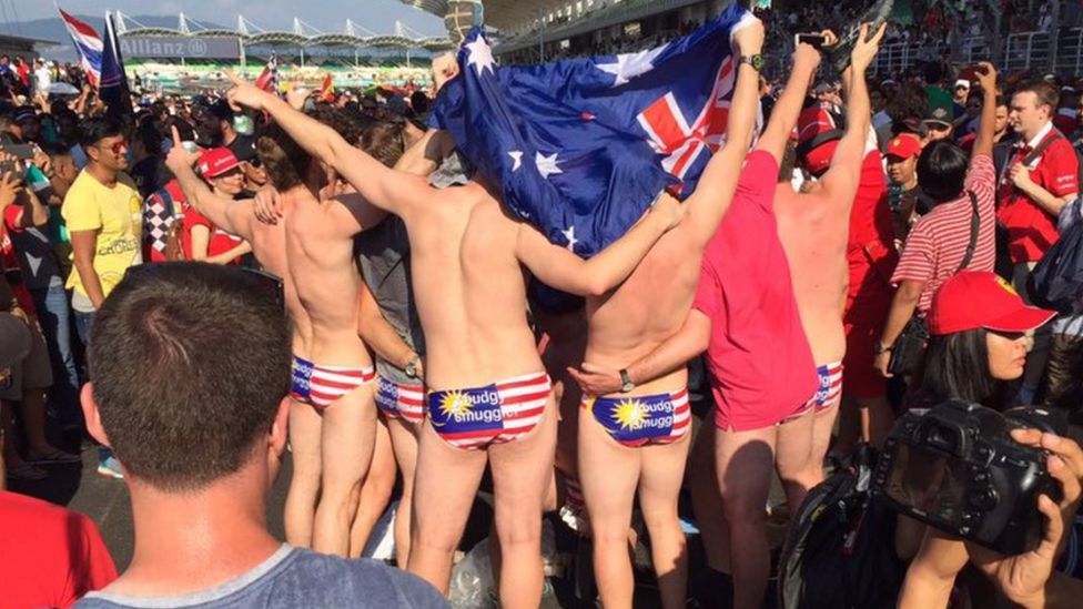 Australian tourists show their underpants bearing the Malaysian flag during the Malaysian Grand Prix, 2 September 2016