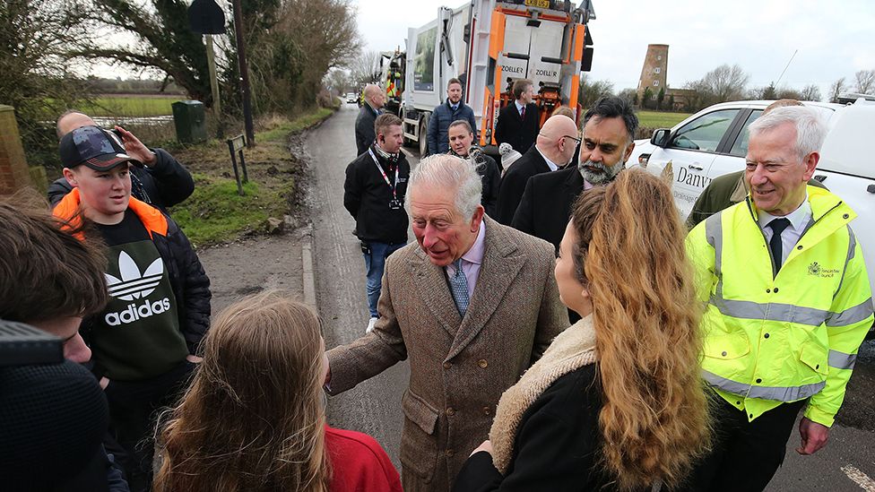 Prince Charles talks to villagers