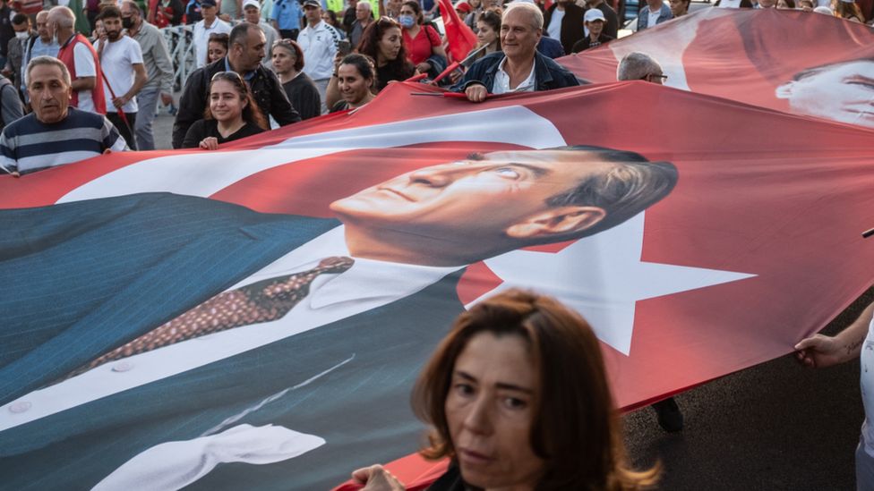 Protesters in Istanbul unfold a giant poster of Mustafa Kemal Ataturk - the founder of the modern secular Turkish state. Photo: 21 May 2022