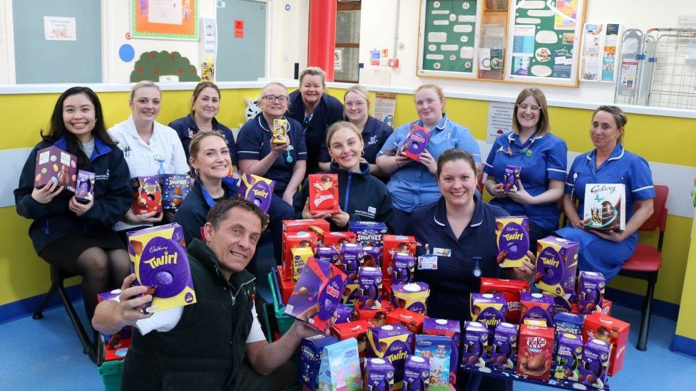 Hospital staff holding Easter eggs