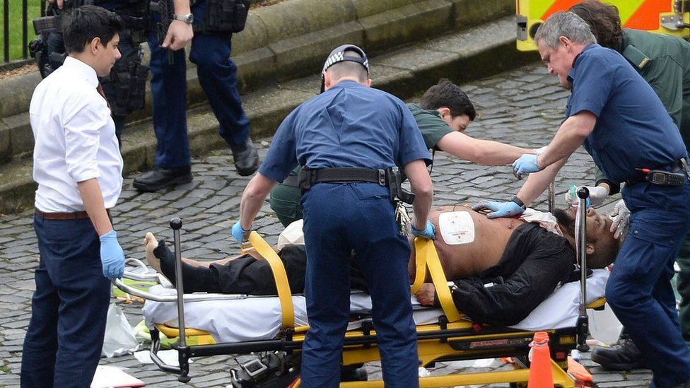 Khalid Masood being treated at the scene of the Westminster attack