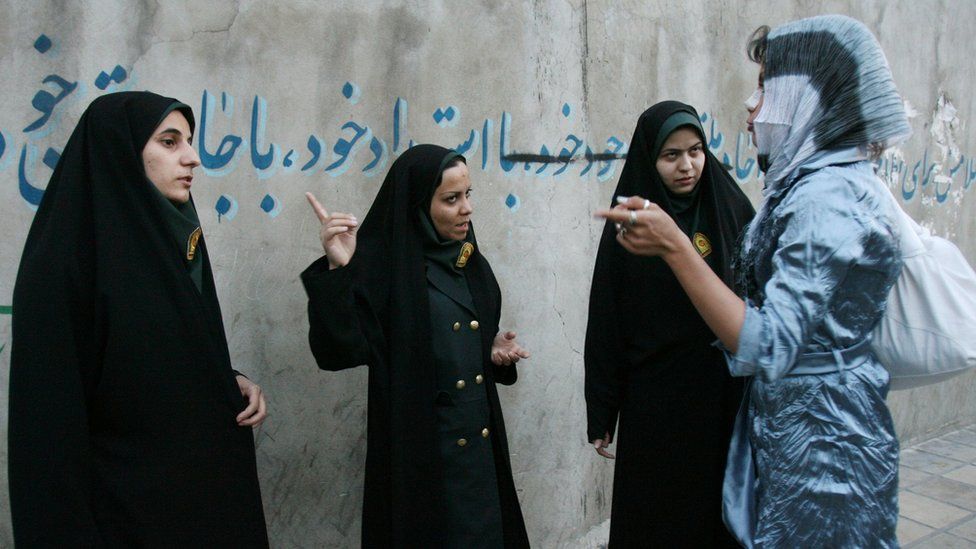 File photo showing Iranian morality policewomen speaking to a woman about her dress in Tehran, Iran (22 April 2007)