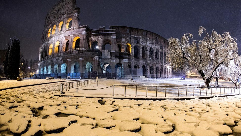 The Colosseum is covered by snow during a snowfall in Rome, Italy, 26 February 2018.