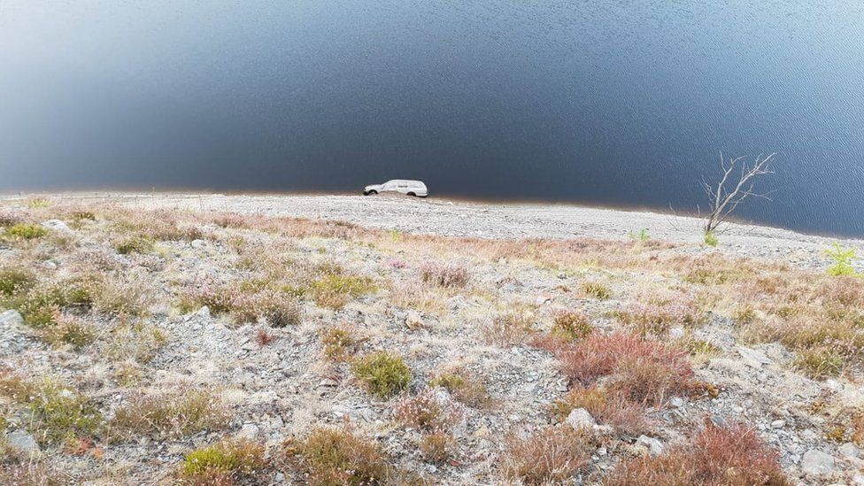 the car at the bottom of the slope