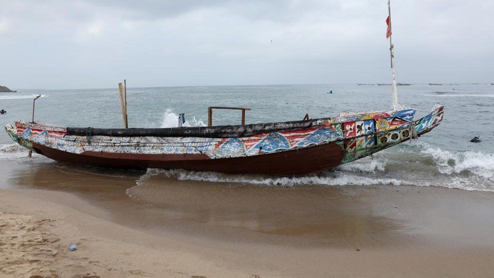 A boat which had been carrying migrants seen aground in Senegal