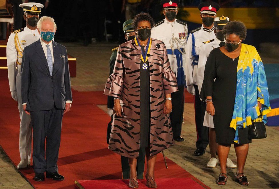 Prince Charles Prince of Wales is joined by President of Barbados Sandra Mason, and Prime Minister of Barbados Mia Mottley as they prepare to depart following the Presidential Inauguration Ceremony at Heroes Square on November 30, 2021 in Bridgetown, Barbados.