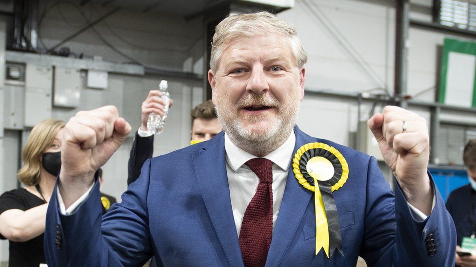 Angus Robertson reacts after winning his seat for at the Parliamentary Elections