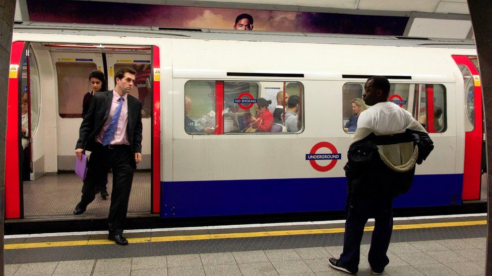 Bakerloo Line train and commuters