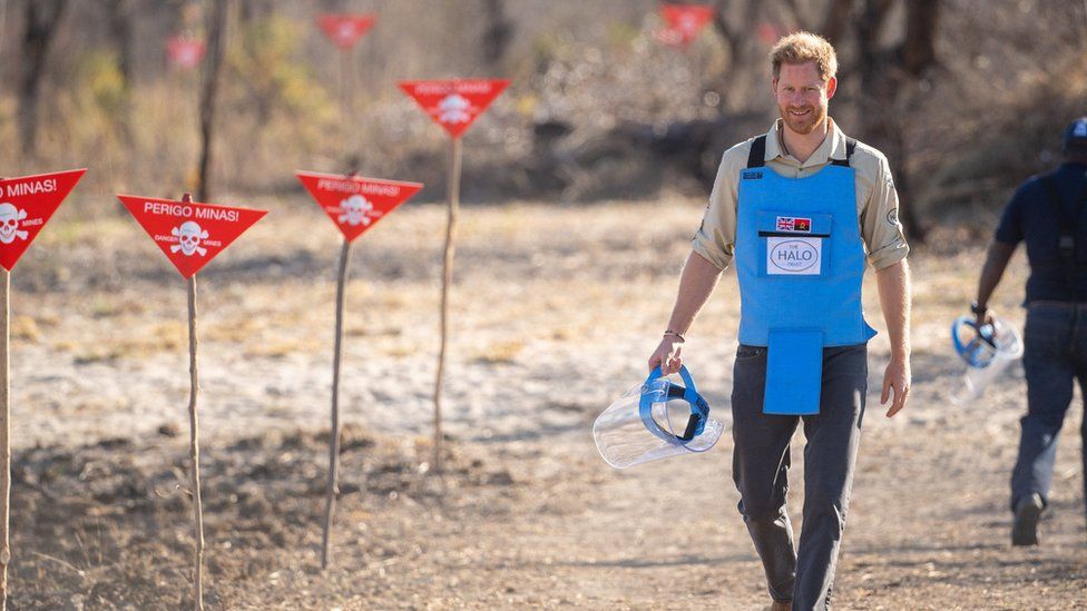Prince Harry walking through a minefield in Angola