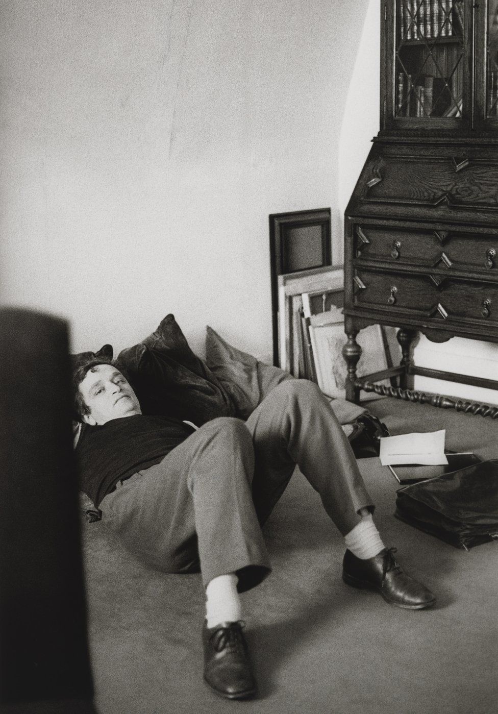 Sir Norman Rosenthal lies on the floor of his flat, 1981-1982