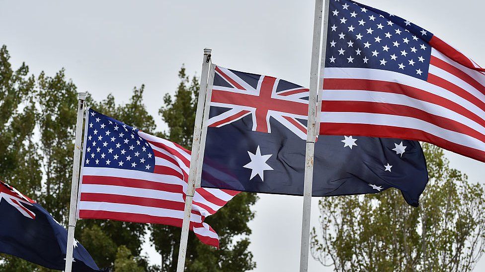 Australian and US flags.