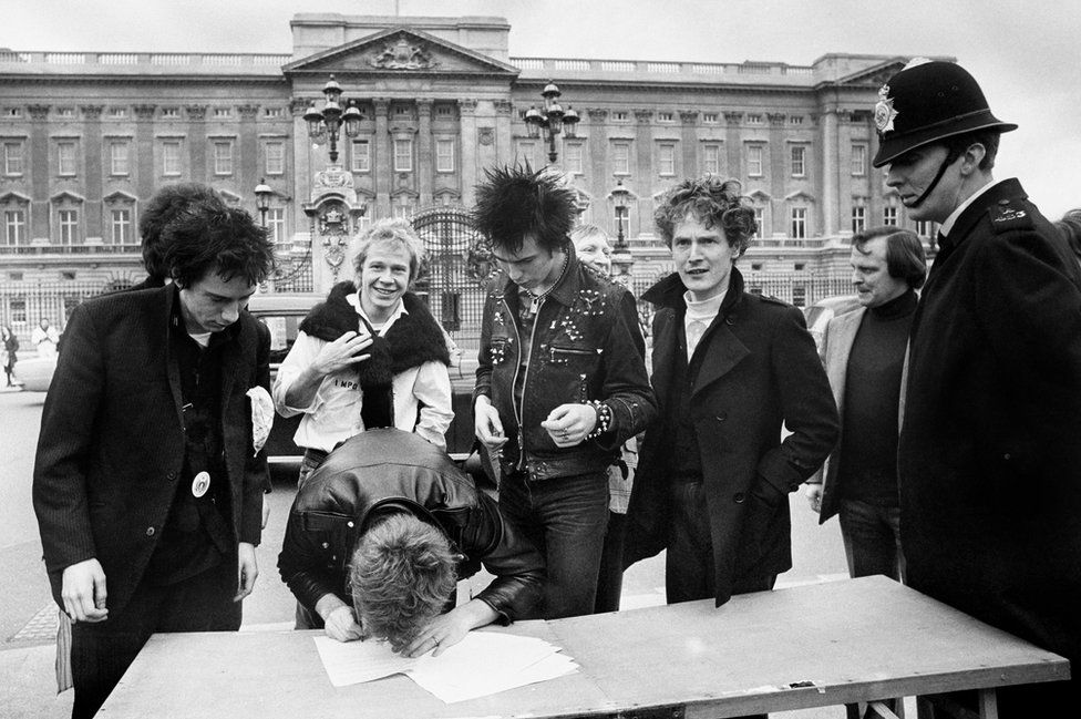 Sex Pistols sign their A&M contract outside Buckingham Palace