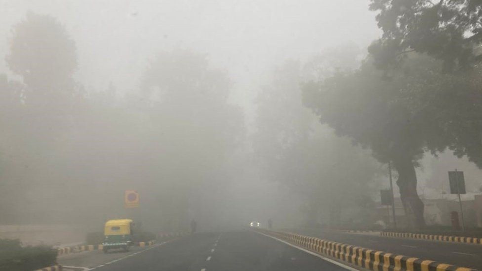 A Delhi road shrouded in fog