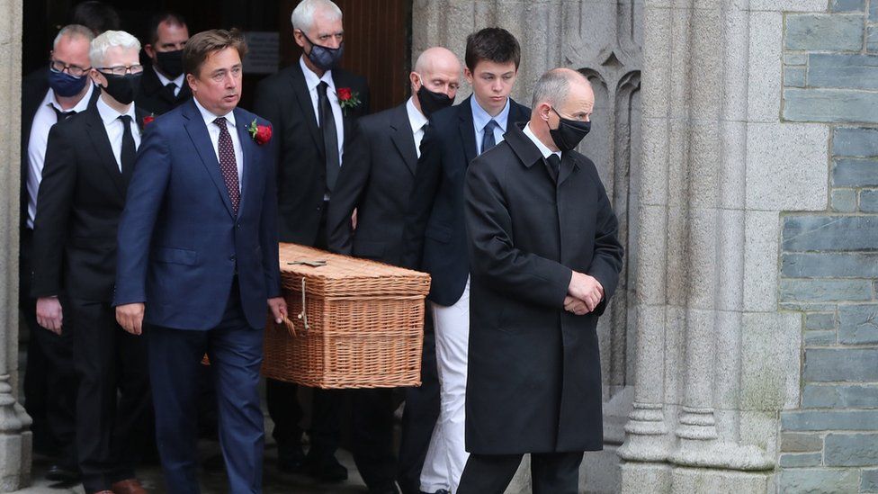 John Hume's coffin leaving St Eugene's Cathedral