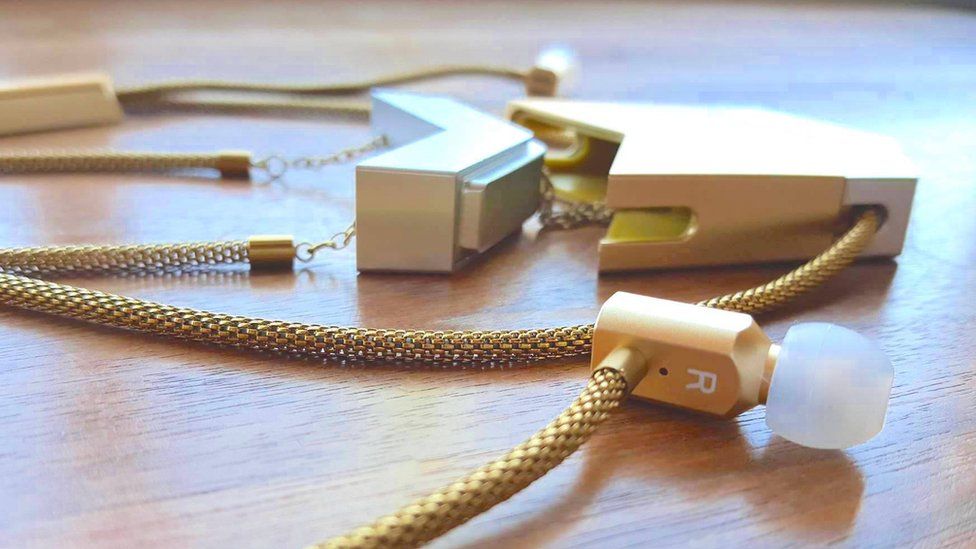 The headphones are stored in a necklace