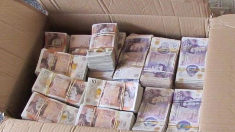 A box of cash seized at the house
