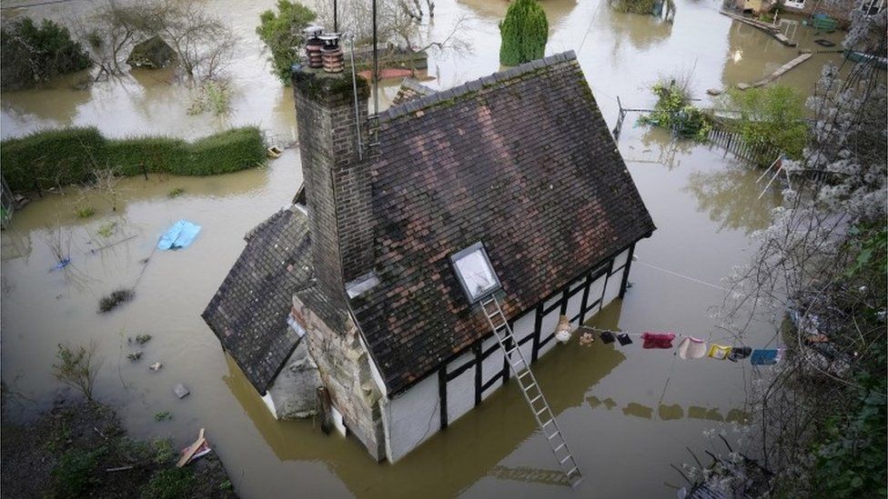 House surrounded by flood water in Ironbridge