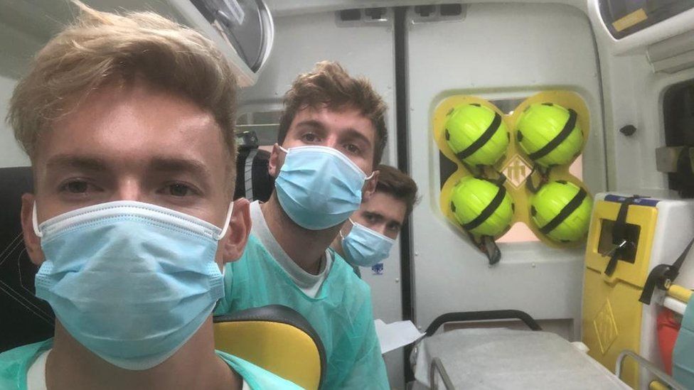 The three friends in an ambulance