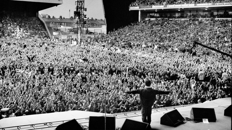 Jill Furmanovsky's photograph of Oasis performing at Manchester City's old Maine Road ground