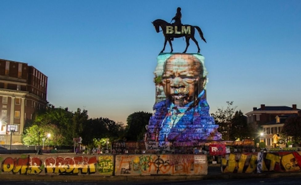 John Lewis projected on to Robert E Lee statue
