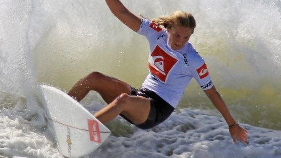 Four time world champion Stephanie Gilmore rides the waves during an exhibition round at the Quiksilver Pro New York tournament