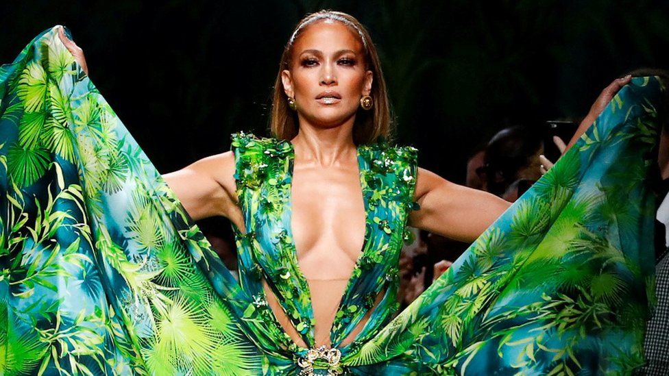 Jennifer Lopez, 50, closing the show at Versace in a recreation of her iconic green dress