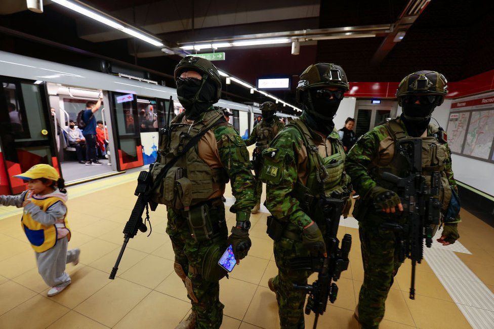 Military officers guard a metro station on January 09, 2024 in Quito, Ecuador. President Noboa declared on Monday 8th a 60-day state of emergency and curfew