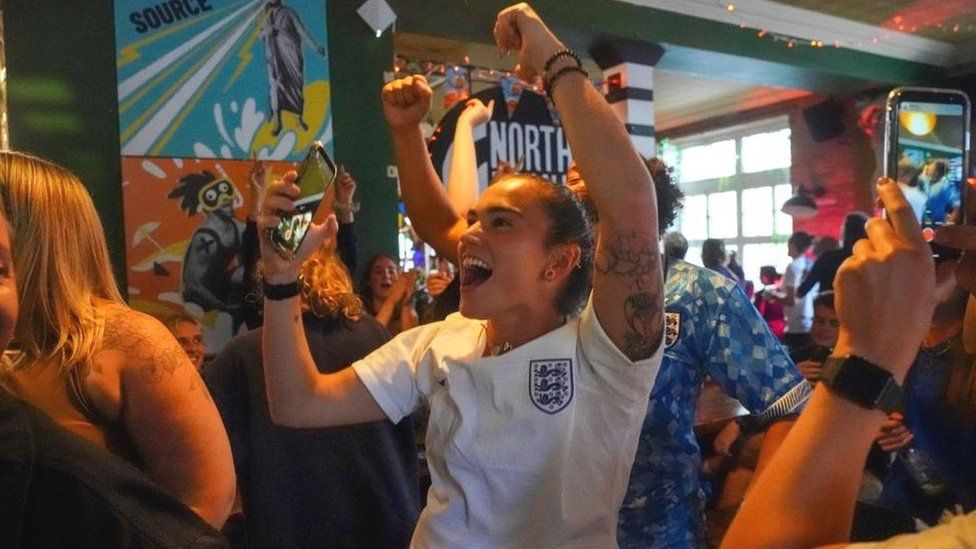 England fans observe  successful  a pub