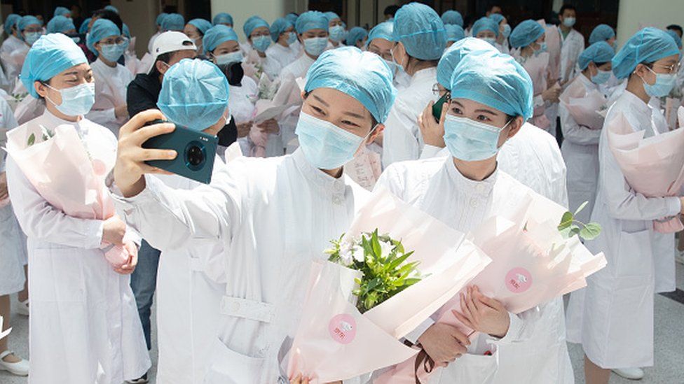 Female medical workers are literally nicknamed in Chinese "beauties who go against the tide"