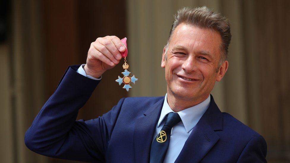 Chris Packham with his CBE medal