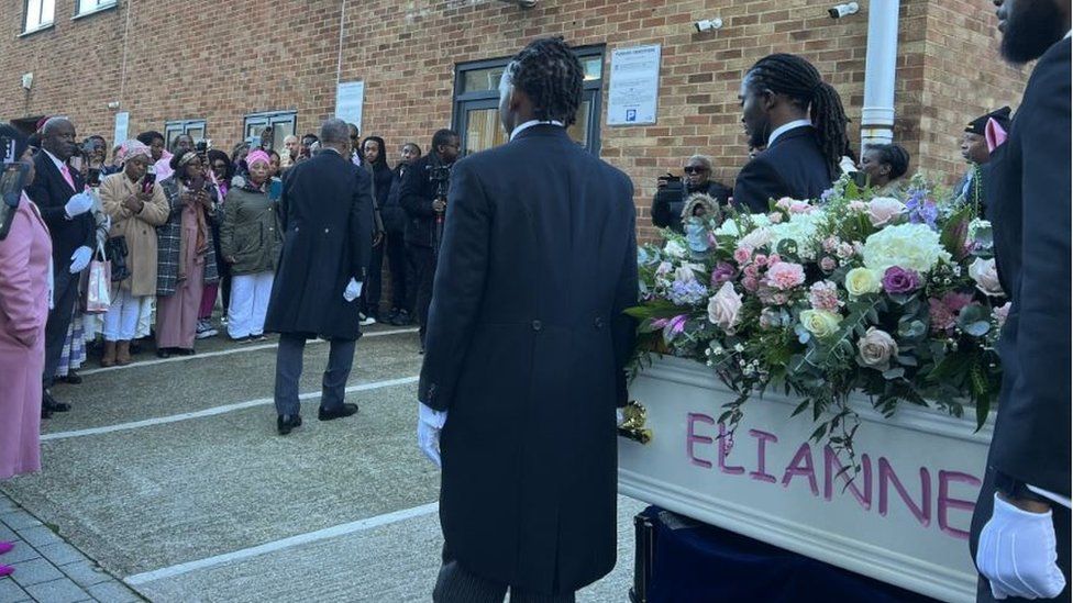 Mourners outside the New Life Christian Centre