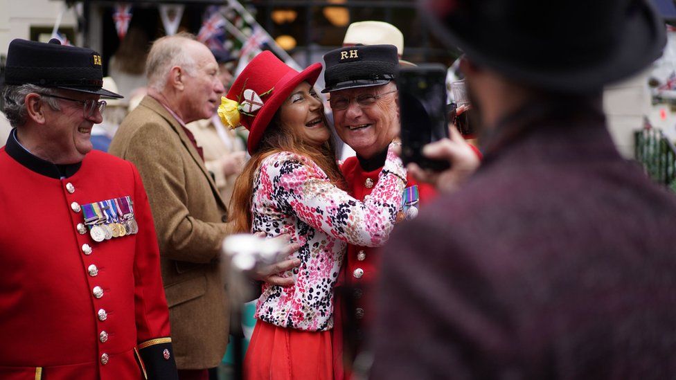 A woman hugs a Chelsea Pensioner at a Jubilee party in Ebury Street, Chelsea