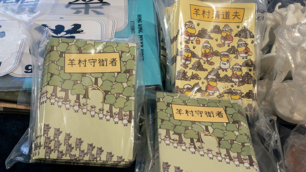 Children's photo books in Hong Kong with sheep and wolves on the cover deemed seditious by authorities.