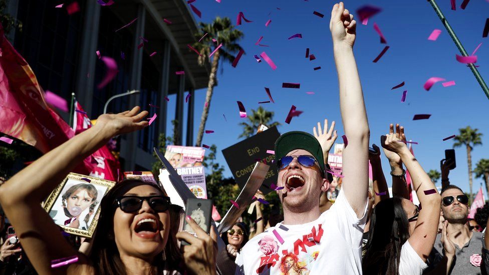 Confetti falls as people cheer after hearing news that Britney Spears' conservatorship had been terminated, Los Angeles, California, 12 November 2021
