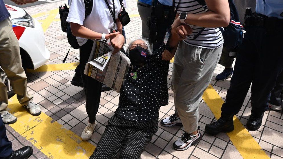 Activist Alexandra Wong is dragged away by police inside court grounds on 19 June