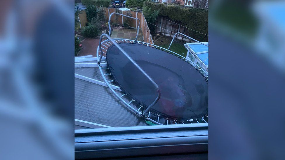 Wind blows trampoline onto conservatory