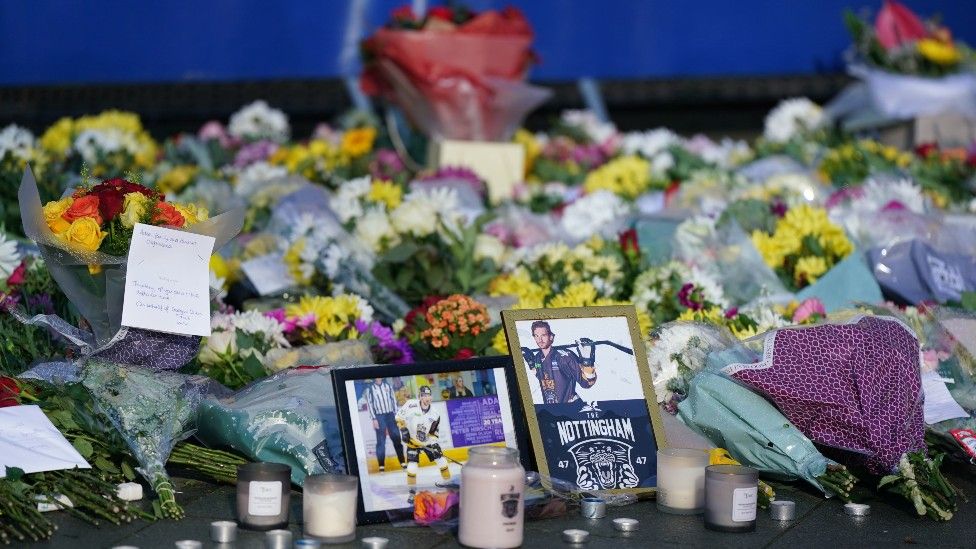 Flowers, candles and photographs outside Nottingham's Motorpoint Arena