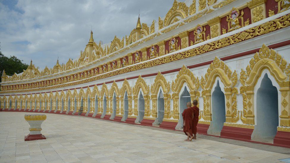 Monks outside a pagoda on the outskirts of Mandalay