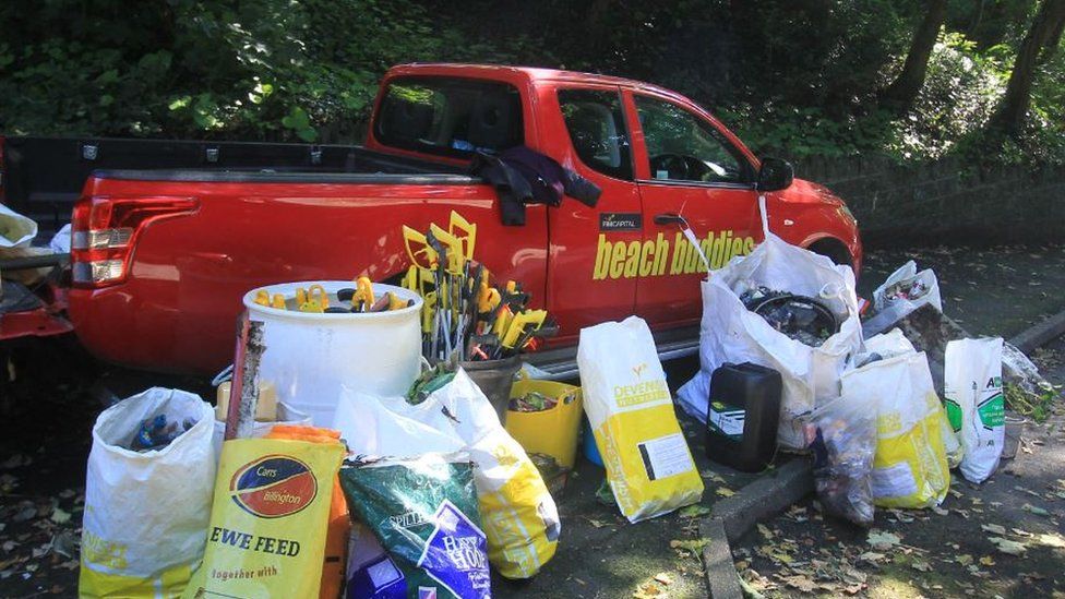 Beach Buddies truck with bags of litter