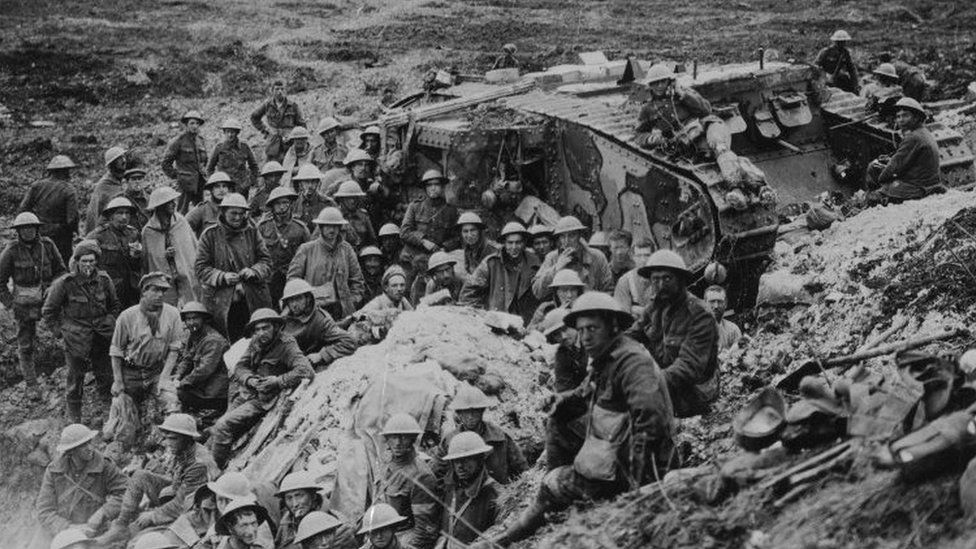 Soldiers and tank in a trench