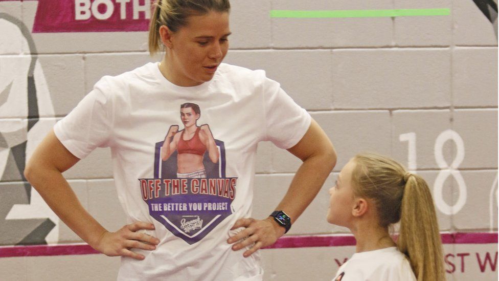 Savannah Marshall in coaching session with child