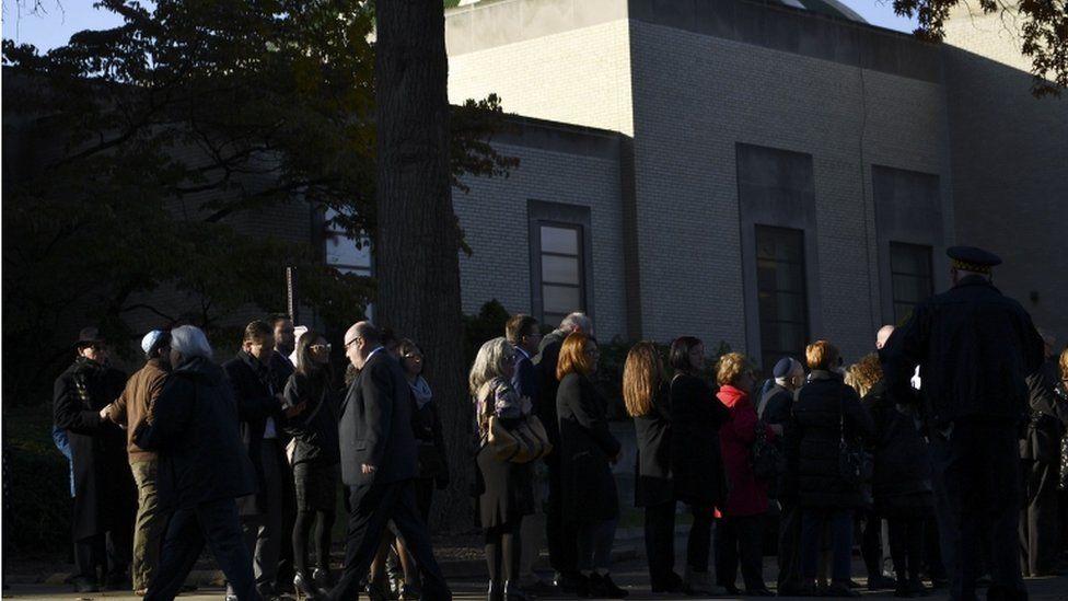 A long line has formed outside the Rodef Shalom Congregation ahead of the first funeral service for the victims