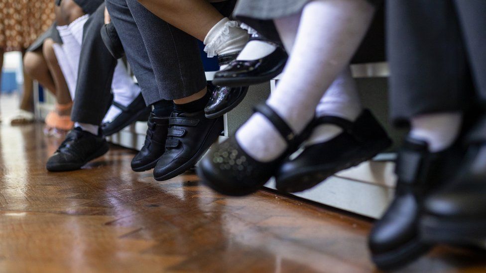 Children's feet in school shoes