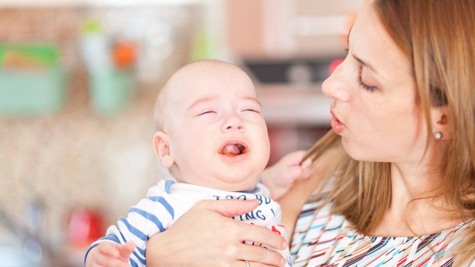 Mum singing to baby