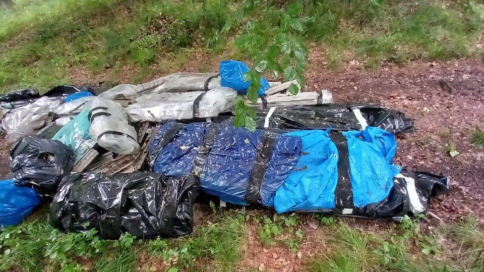 The bags of asbestos dumped in the forest